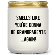 a white jar with black words on it that says smells like you're gonna be grandparents again