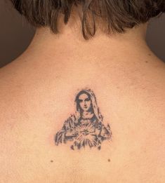 a woman with a tattoo on her back