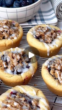 blueberry crumb muffins cooling on a rack