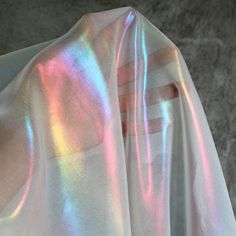 This rainbow reflective fabric is designed specifically for making clothing and accessories that stand out in a crowd. The fabric is iridescent and features a rainbow holographic laser effect. It's designed specifically for making attention-grabbing pieces that will turn heads. Dimension: Width: 150cm / 59 inches Wash: Dry wash is recommened The fabric is top qulaity designer farbric on the market. It is lightness, color illusion, good drape, and a cool touch. It is perfect for swimwear, dresses Dance Clothing, Chiffon Fabric, Primavera Estate