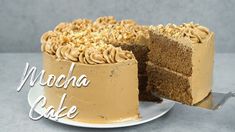 there is a cake that has been cut in half and the words mocha cake on it