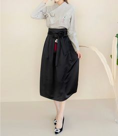 This is a Korean Modern Women's Hanbok satin skirt suitable for spring/fall and summer. This skirt is not a wrap style, but can be worn comfortably with a side zipper and elastic waistband at the back. A design that looks like the fabric itself has wrinkles is a characteristic of the fabric. Please note that this is not a reason for return. This hanbok is modernly designed so you can wear it comfortably and beautifully. This modern hanbok is perfect dress for daily and celebrations such as parti Spring Satin Full Skirt, Spring Full Satin Skirt, Silk Workwear Skirt For Fall, Silk Skirt For Workwear In Fall, Silk Flowy Skirt For Fall, Flowy Silk Skirt For Fall, Fall Silk Skirt For Work, Satin Party Skirt, Casual Satin Skirt For Party