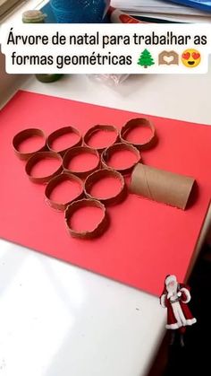 an image of a craft made out of toilet paper and rolled up circles on top of a table