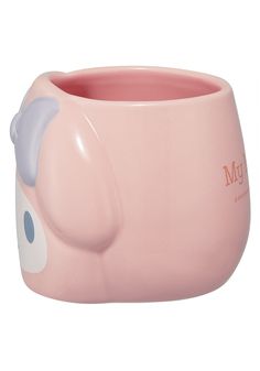 a pink mug with an elephant design on it