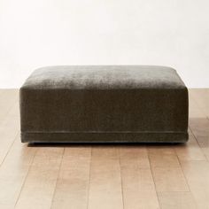 Faible Modern Grey Performance Velvet Ottoman + Reviews | CB2 Large Square Leather Ottoman, Studio Mcgee Family Room, Suede Ottoman, Statement Ottoman, Fabric Covered Ottoman, Upholstered Ottoman Coffee Table, Square Ottoman Coffee Table, Square Ottomans, Soft Ottoman