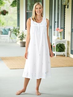 The sweetest embroidered flowers add pops of pretty color across this fresh and crisp-looking sleeveless gown. It's made of soft, breathable cotton and is adorned with ruffle and grosgrain ribbon details and a button-front placket for easy dressing. Lightweight cotton ensures a comfortable night's rest Ruffle and grosgrain ribbon details Button-front placket for easy dressing Relaxed, generous fit Approx. 48" long 100% cotton Machine wash and dry Imported | Embroidered Flowers Cotton Nightgown - Nighty Night Dress, Vermont Country Store, Eileen West, Cotton Gowns, Cotton Nightgown, Sleeveless Gown, Women's Nightgowns, Nightgowns For Women, Country Store