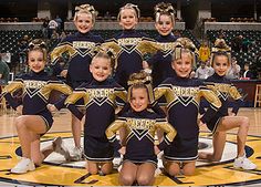 the cheerleaders are posing for a photo