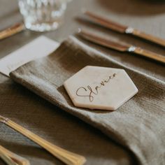 a place setting with napkins and silverware