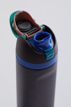 a black and blue water bottle sitting on top of a table