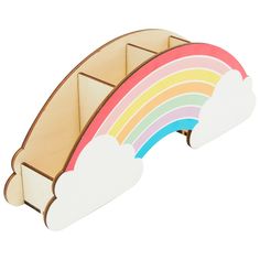 a wooden toy with a rainbow and clouds on it