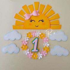 the first birthday cake topper is decorated with flowers