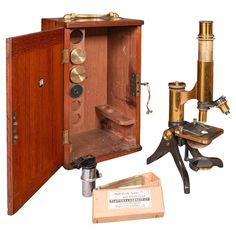 an old fashioned microscope and other antique tools