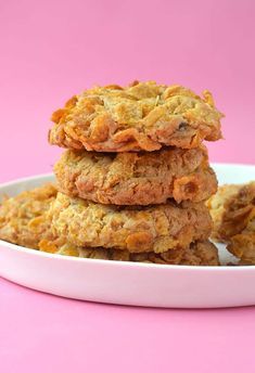 three oatmeal cookies stacked on top of each other in a white bowl