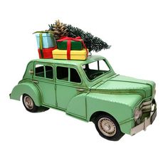 an old green car with presents on the roof and christmas tree in the trunk, isolated against a white background