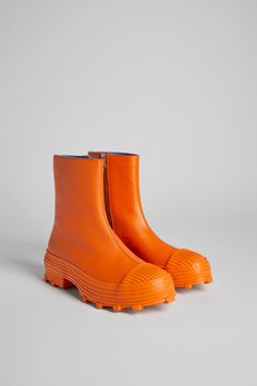 Vulcanized orange leather zip boots with toothed rubber outsoles and OrthoLite® cushioned footbeds. Orange Waterproof Boots With Round Toe, Colorful Boots, Camper Boots, Interesting Shoes, Orange Boots, Camper Shoes, Funky Shoes, Orange Shoes, Spring Summer Collection