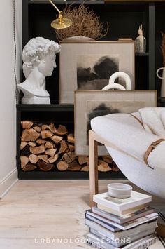 a living room filled with furniture and books