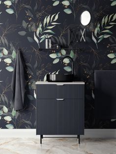 a bathroom with black and green wallpaper, a sink and mirror in the corner