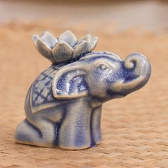 an elephant figurine with a crown on its head