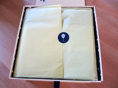 an open box with two pieces of cloth in it