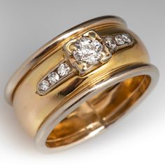 two gold wedding rings with diamonds on them