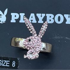 This Is New With Tags And Is Super Cute! Lots Of Bling That’s Sure To Get You Attention! This Is A Size 8. I Have Four Of These Available. Two Are A Size 8 And Two In A Size 9. I Also Have The Same Rings In A Crystal Color In A Size 8 And 9 Available. Makes A Great Gift! Please Check Out My Other Playboy Jewelry! I Will Continue To Add More! Bundle, And Save! Cheap Y2k Pink Jewelry, Mcbling Jewelry, Pink Playboy, Playboy Jewelry, 2000s Accessories, Play Boy Belly Button Rings, 2000s Jewelry, Y2k Rings, Playboy Necklace Gold