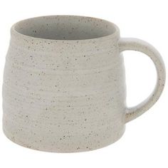 a white coffee mug with speckles on the outside and inside, sitting in front of a white background