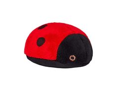 a red and black ladybug hat on a white background