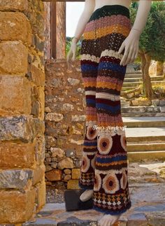 a mannequin is dressed in multicolored crochet