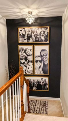 a staircase with pictures on the wall and carpeted stairs leading up to an upstairs landing