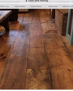 a living room with wooden floors and furniture