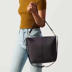 Perfect for the workday and beyond, the Mini Zip Bucket is a smaller take on our classic Bucket Bag. A functional style made to move, this design in an almost black, deep blue hue secures your essentials with a top zipper and three interior pocketsand adapts to your plans with its detachable top handle. Plus, its made with marine plastic. Xmas Wishlist, Mary Jane Clogs, Mini Bucket Bag, Mini Bucket Bags, Holiday Bag, Mini Bucket, Sling Bags, Belt Bags, Clutch Pouch