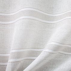 a white fabric with wavy lines on it