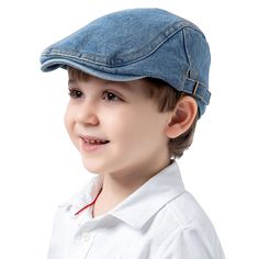 a young boy wearing a blue denim cap