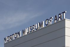 the north museum of art sign is on top of a tall building with blue sky in the background