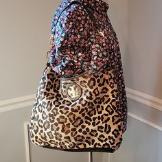 Vintage Tory Burch Calf Hair Leopard Printed Hobo Style Shoulder Bag Please See Pictures For Measurements Preloved Condition Normal Wear On Bag Scratches And Tarnishing On Metal Hardware Interior Is Clean And Free Of Stains. Interior Has One Zippered Pocket And Two Open Pockets Large Roomy Bag Please Review Pictures As They Are Part Of The Description Feel Free To Ask Questions Or Make A Reasonable Offer Check Out My Closet For Additional Women's Items From J.Crew, Dooney & Bourke, Ugg, Boden And More Leopard Print, Vintage, Animal Print, Calf Hair, Shoulder Bag, Hobo, Designer, Gold Hobo Style, Tory Burch Bag, Calf Hair, Metal Hardware, Dooney Bourke, Brown Gold, Tory Burch, Leopard Print, Animal Print