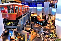 an overhead view of a museum with people looking at items