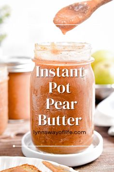 peanut butter is being poured into a jar with the words instant pot pear butter on it