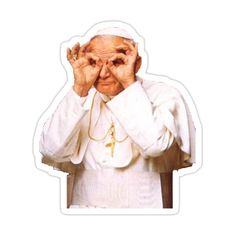 the pope is covering his eyes with both hands