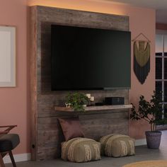 a large flat screen tv mounted to the side of a wall in a living room