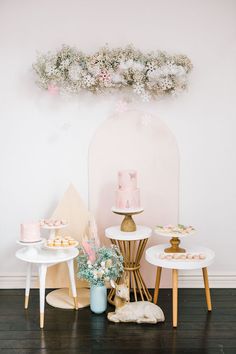 the dessert table is decorated with pink and gold decorations