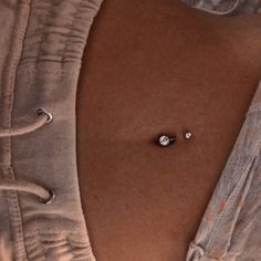 a close up of a person's stomach with an object on it