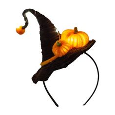 a halloween hat with pumpkins on it