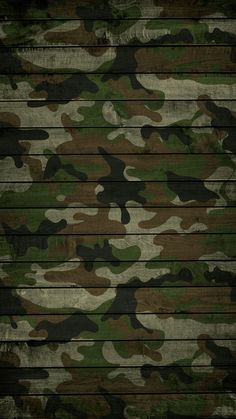 the camouflage wallpaper has been made with wood planks and is very dark green