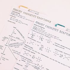 two notebooks with diagrams on them sitting next to each other, one containing organic energy reactions