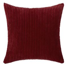 a red pillow with pleated cording on the front and back, sitting on a white background