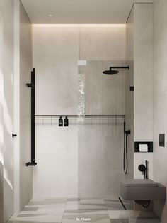 a modern bathroom with black and white fixtures on the walls, tile flooring and a walk in shower