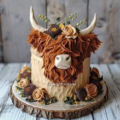 a cake decorated with an animal's head and flowers