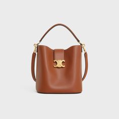 MEDIUM LOUISE BAG IN SMOOTH CALFSKIN - TAN | CELINE High-end Tan Shoulder Bag, Quite Luxury Bags, High-end Bucket Bag, High-end Tan Shoulder Bag With Removable Pouch, High-end Bucket Shoulder Bag For Daily Use, High-end Bucket Satchel, High-end Brown Shoulder Bag With Adjustable Strap, High-end Tan Crossbody Shoulder Bag, High-end Bucket Bag With Detachable Strap Satchel