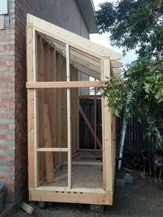 a building that is made out of wood and being built into the side of a house