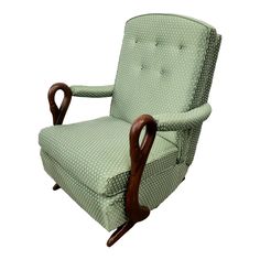 an upholstered green chair with wooden arms and foot rests against a white background